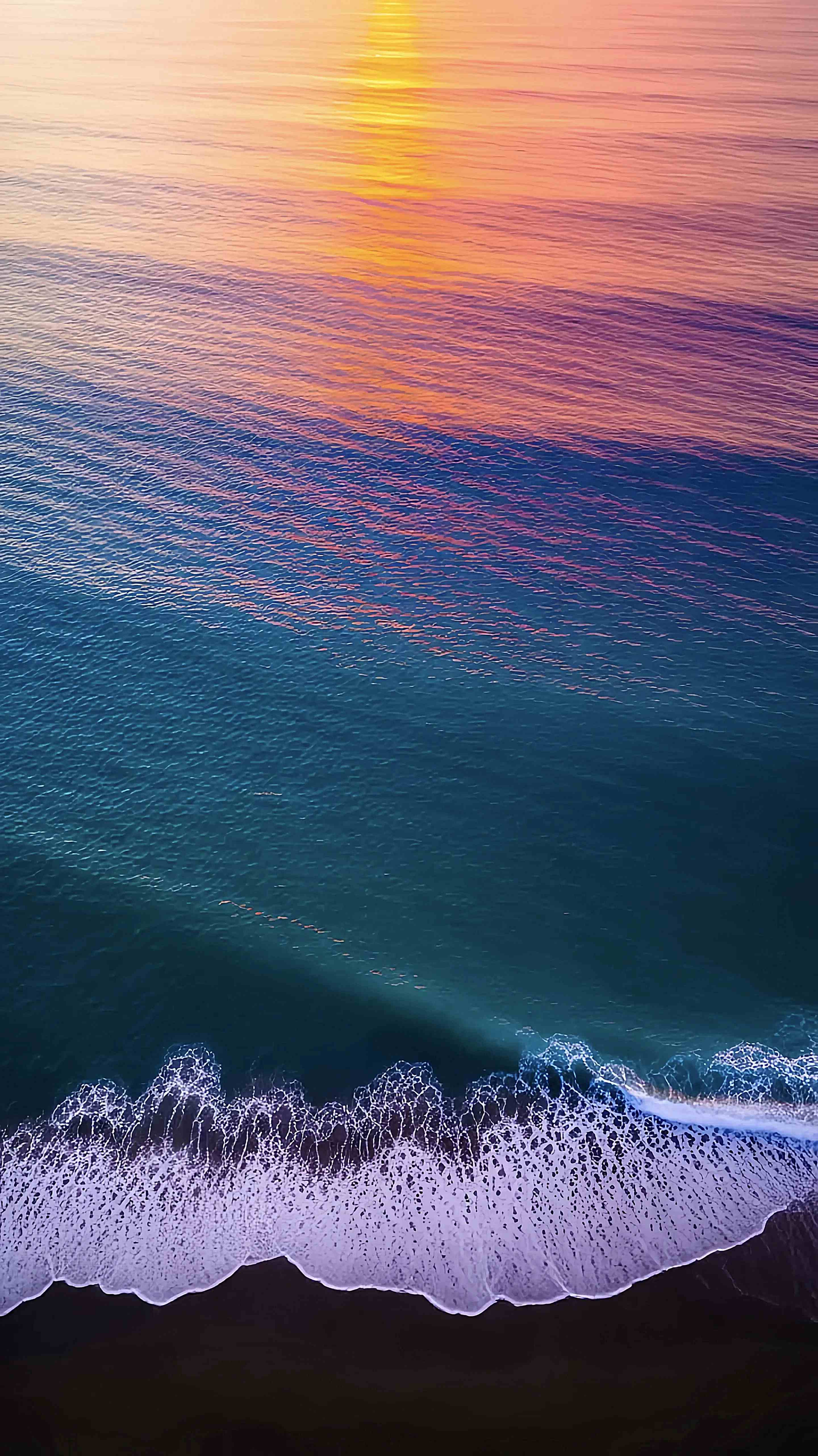 Ocean Waves Sunset Aerial View Vibrant Wallpaper